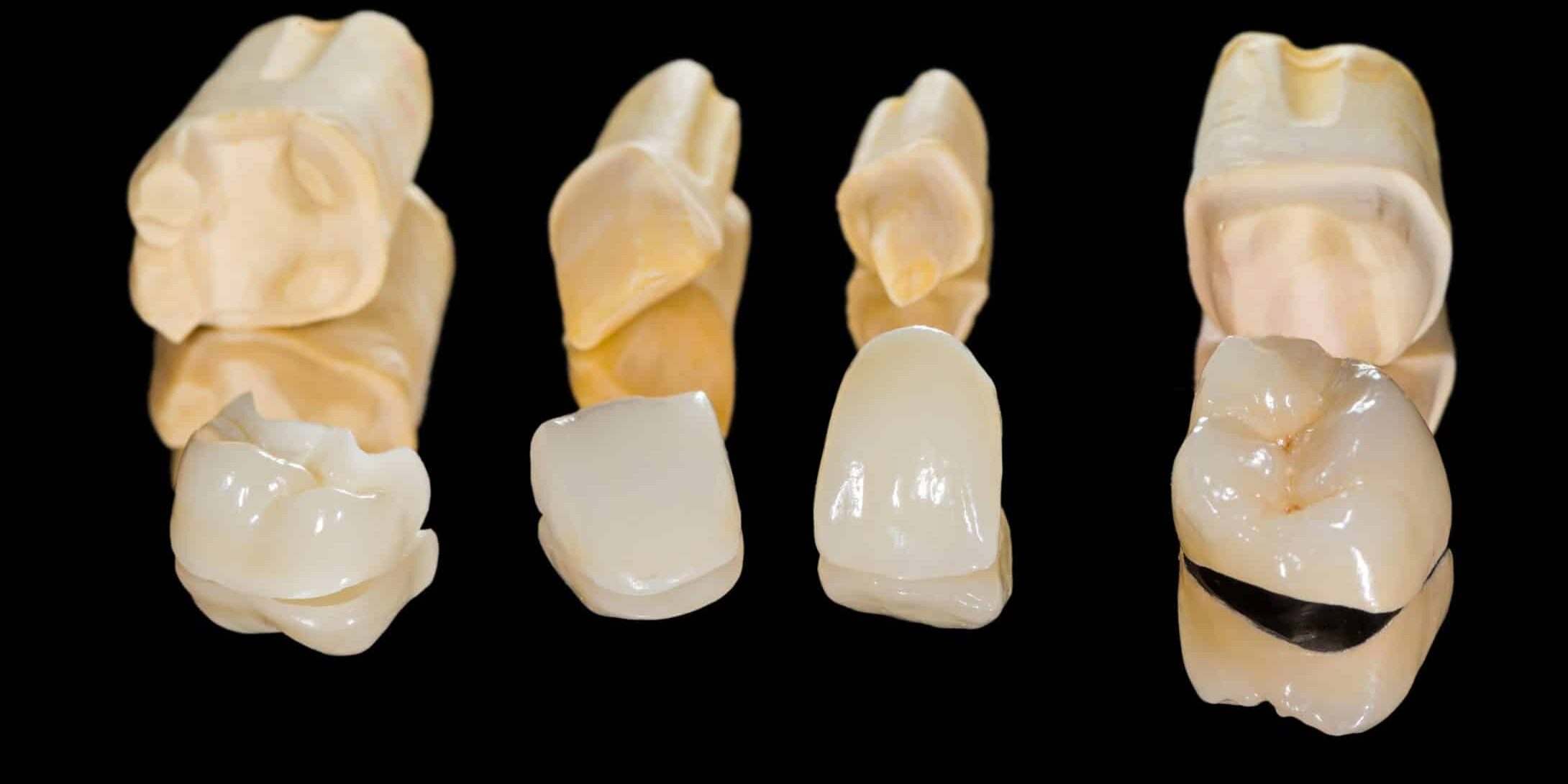 Dental ceramic crowns on isolated black background